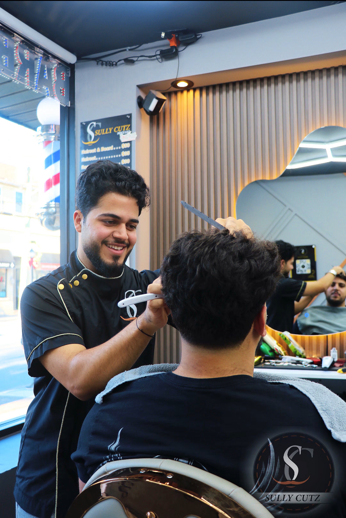 All smiles in the Sully Cutz chair